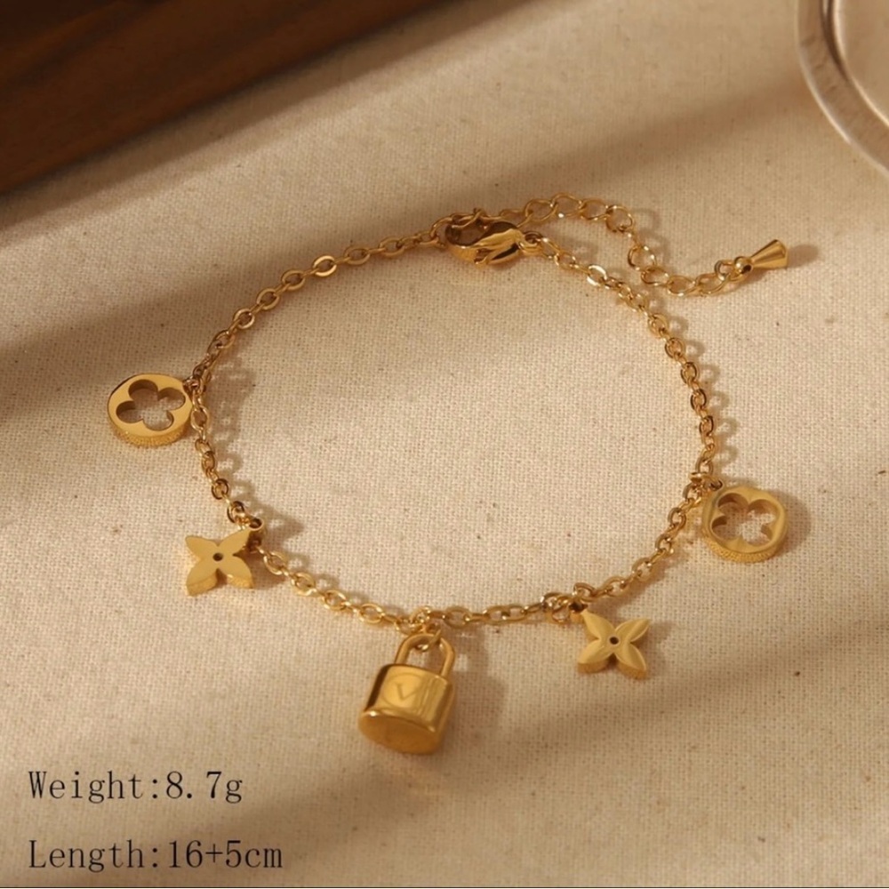 18K Gold Designer Charm Bracelet with Lock and Flower Accents - Picture 5 of 8